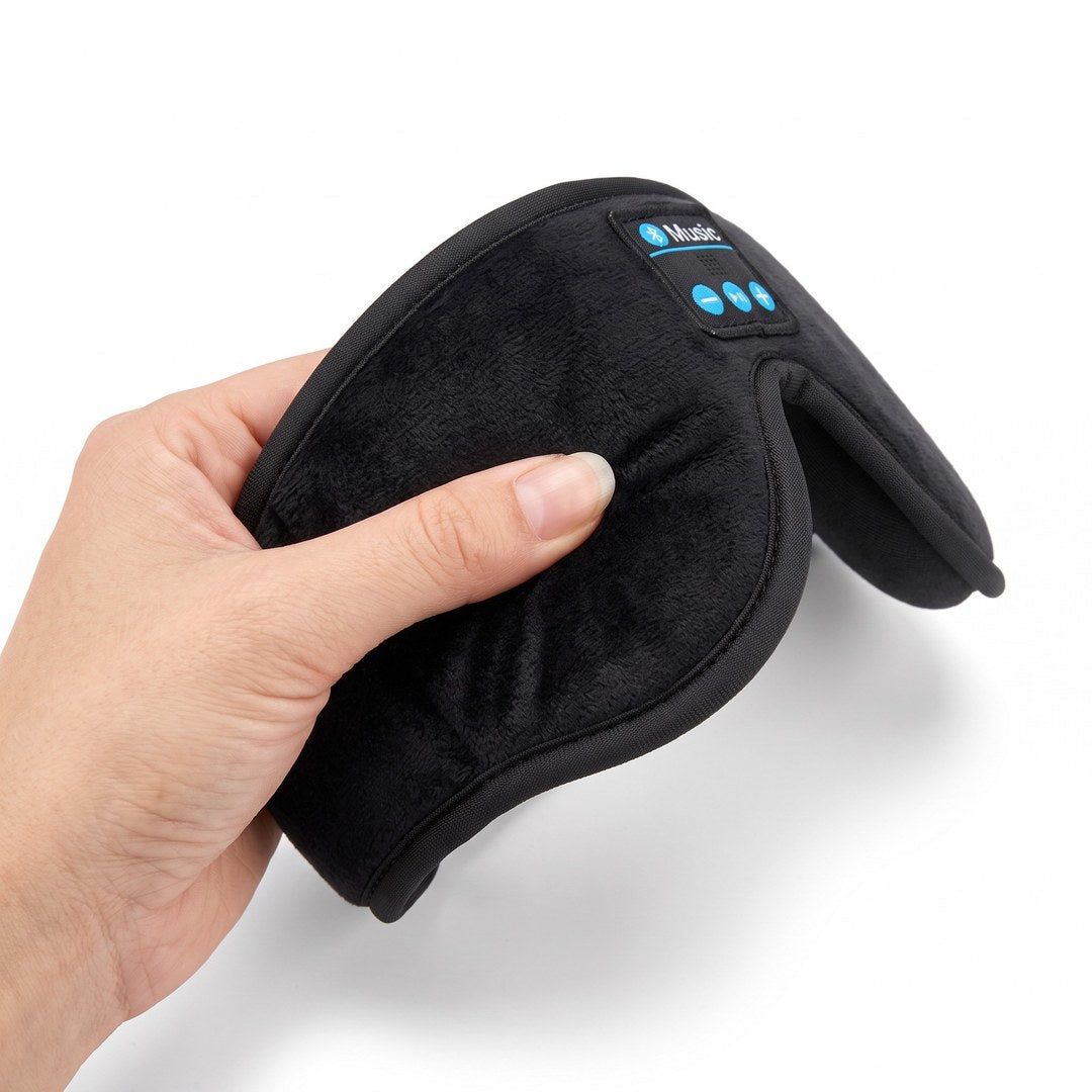 A thumb pressing into the plush padded front of the band